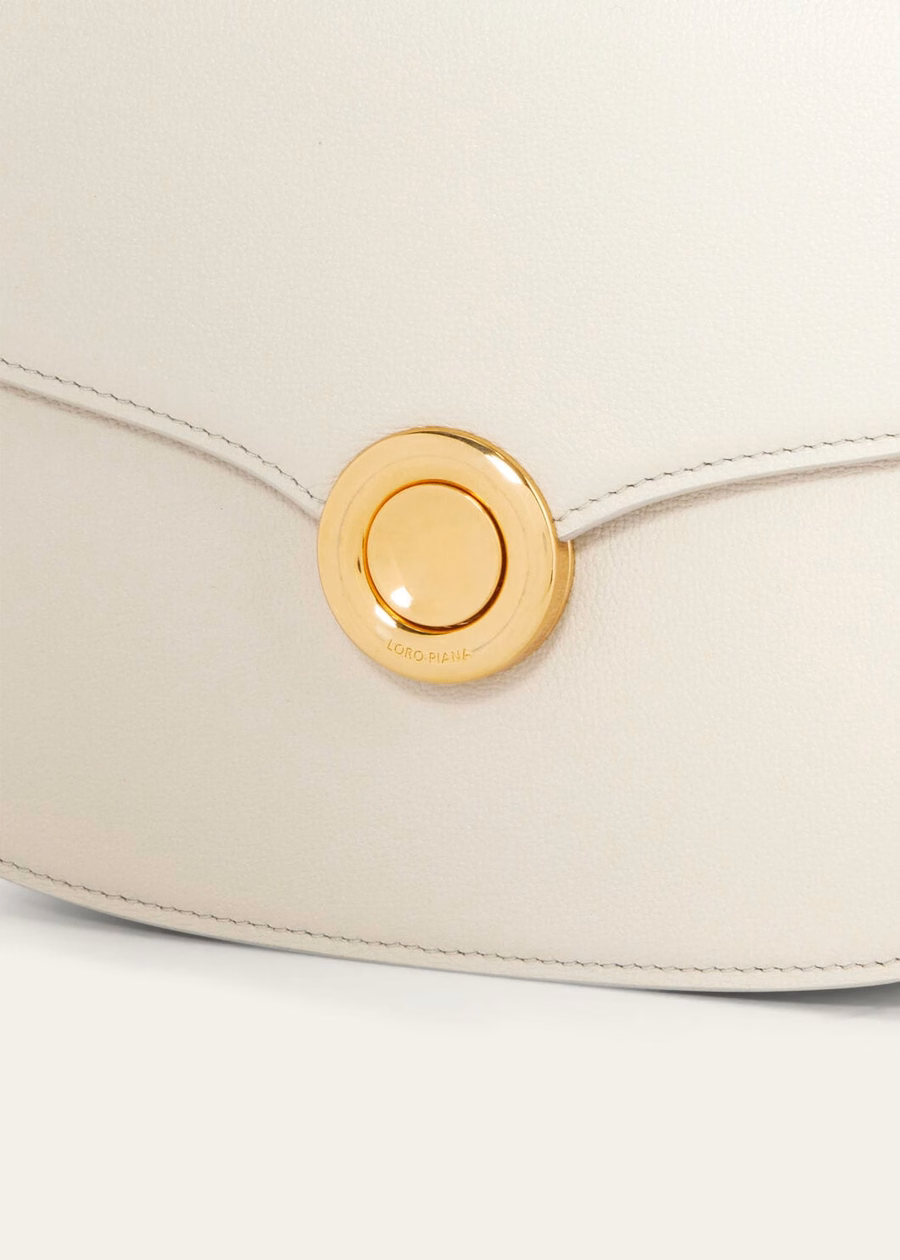 Bolso pequeño Ghiera de piel de becerro granulada color travertino claro/oro sol.
